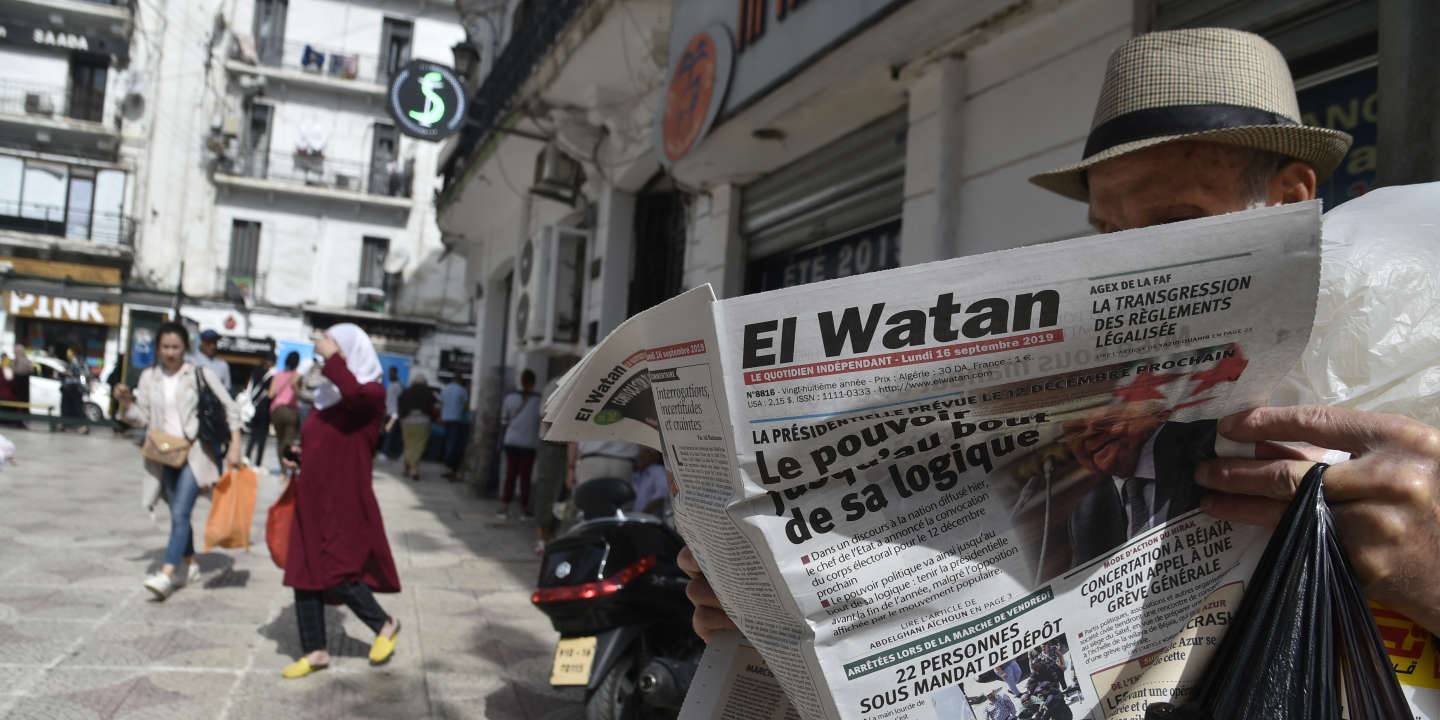 A man reads an Algerian French-language newspaper, with its cover dominated by the announced Algerian presidential election date, as he sits a along street in the capital Algiers on September 16, 2019. - Algeria is to hold presidential elections on December 12, five months into a political vacuum since longtime leader Abdelaziz Bouteflika resigned in the face of mass protests, his interim successor announced on September 15. The announcement comes after army chief General Ahmed Gaid Salah, seen as Algeria's strongman since the fall of the ailing Bouteflika, insisted that polls be held by the end of 2019, despite ongoing protests demanding the creation of new institutions ahead of any elections. (Photo by RYAD KRAMDI / AFP)