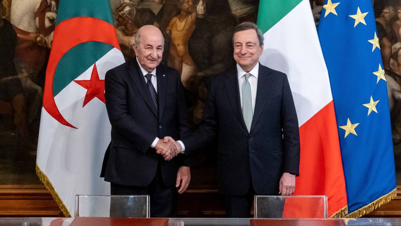 Italian Prime Minister Mario Draghi, right, shakes hands with Algerian President Abdelmadjid Tebboune, background left, at Rome's Palazzo Chigi, Thursday, May 26, 2022. (Mauro Scrobogna/LaPresse via AP)/LBL806/22146483868926/ITALY OUT; MANDATORY CREDIT/2205261535