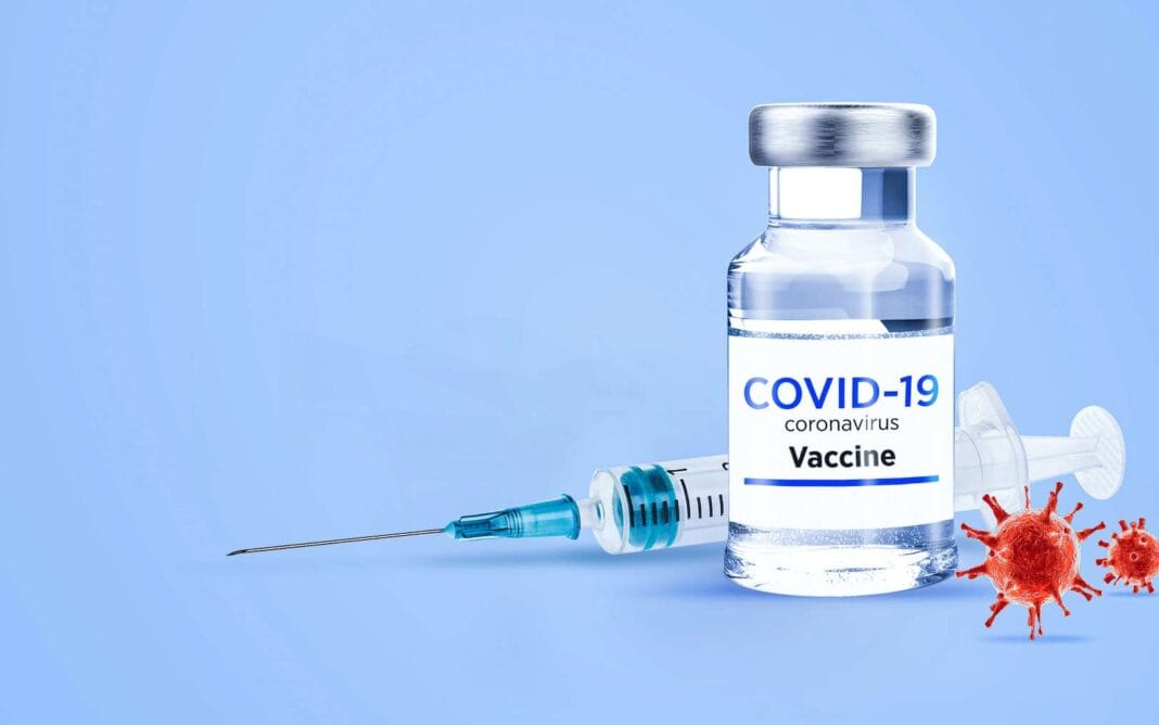 Coronavirus : 124 nouvelles contaminations et 5 nouveaux décès Vial de vaccin COVID-19 avec seringue et virus coronavirus.