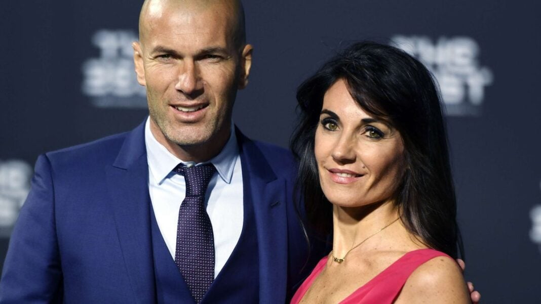 Zinedine Zidane zappe le Real Madrid et dévoile sa préférence pour son prochain poste Homme et femme posant lors d'un événement professionnel.