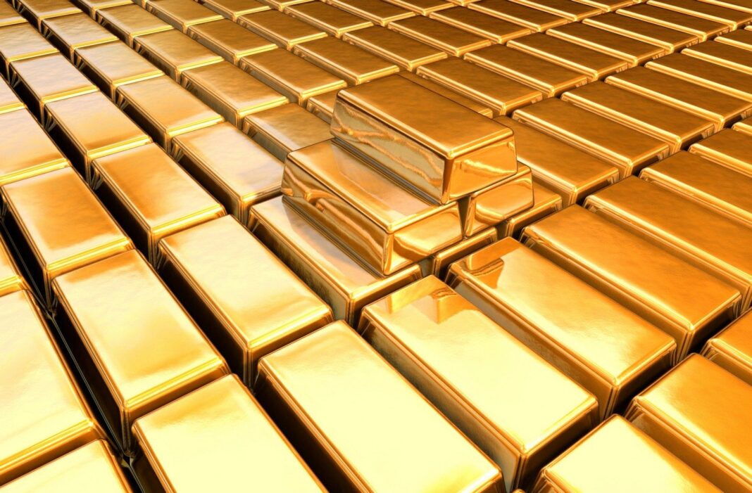L’APOCE sort un outil technologique contre l’or frelaté Lingots d'or empilés avec éclat brillant, symbole de richesse et de stabilité financière.