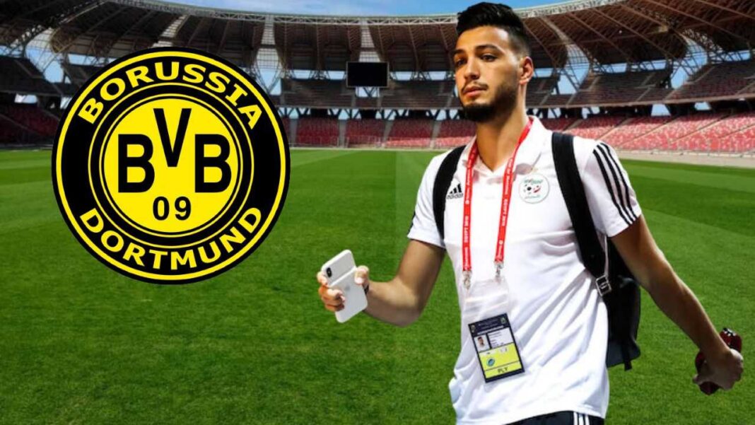 Mercato: le Prix du transfert de Bensebaini au Borussia Dortmund Bensebaini avec le logo du Borussia Dortmund au stade.