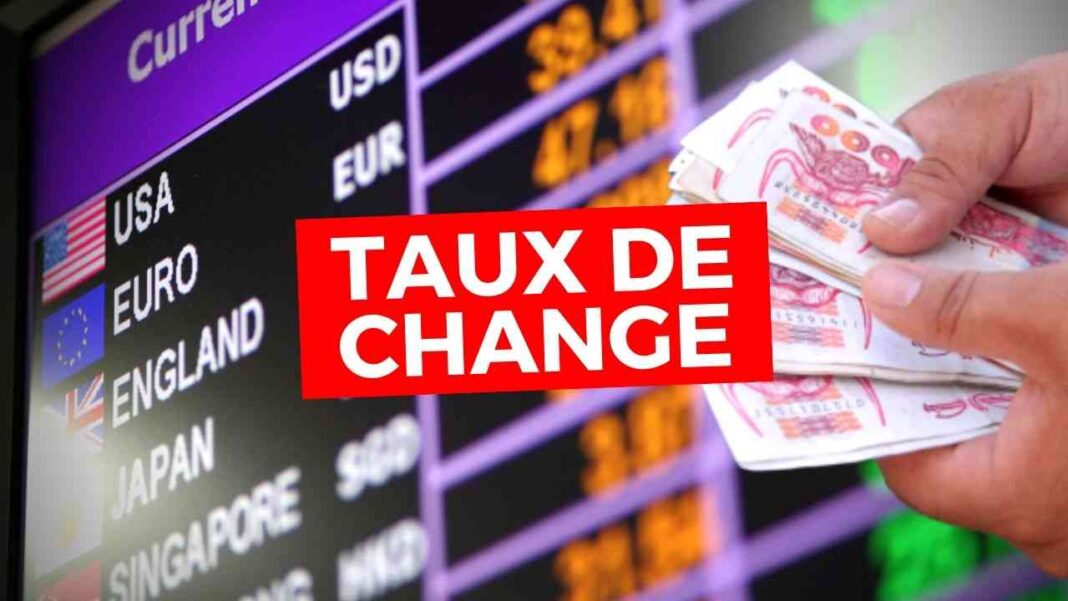 Taux de change euro en baisse sur un tableau de devises.