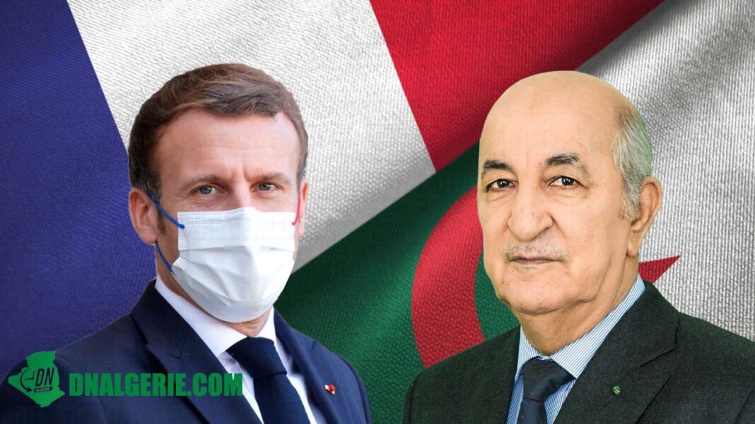 Match France Algérie : Nouvelle réaction de Tebboune Deux hommes en costume avec masques, fond de drapeaux français et algérien.