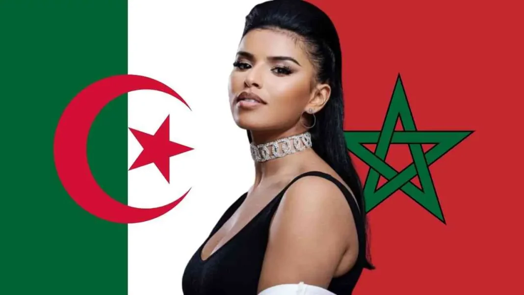 Pour Imen ES, les matchs « PSG – OM sont comme Algérie – Maroc » Femme posant avec drapeaux de l'Algérie et du Maroc en arrière-plan.