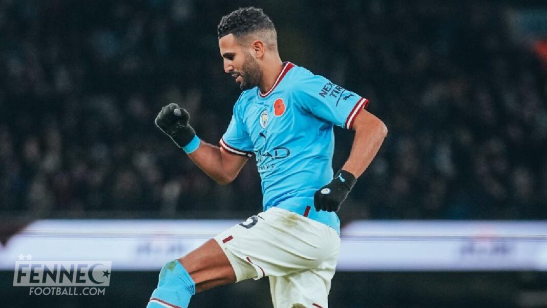 Mahrez en action lors d'un match de football, célébrant un but ou une victoire.
