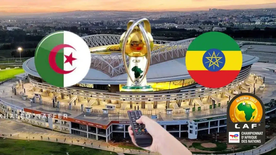 Stade de football avec drapeaux d'Algérie et d'Éthiopie lors d'un match.