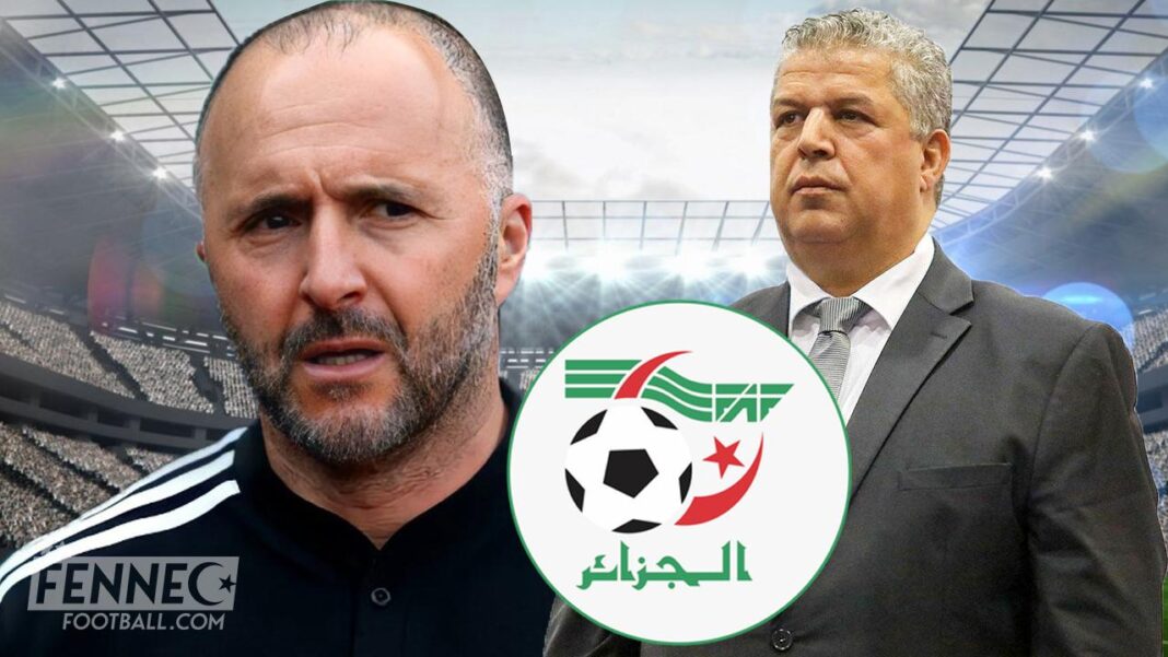 Scandale dans l’Equipe d’Algérie : un ex responsable fait d’énorme révélation Deux hommes en costume dans un stade, logo de la FAF au centre.