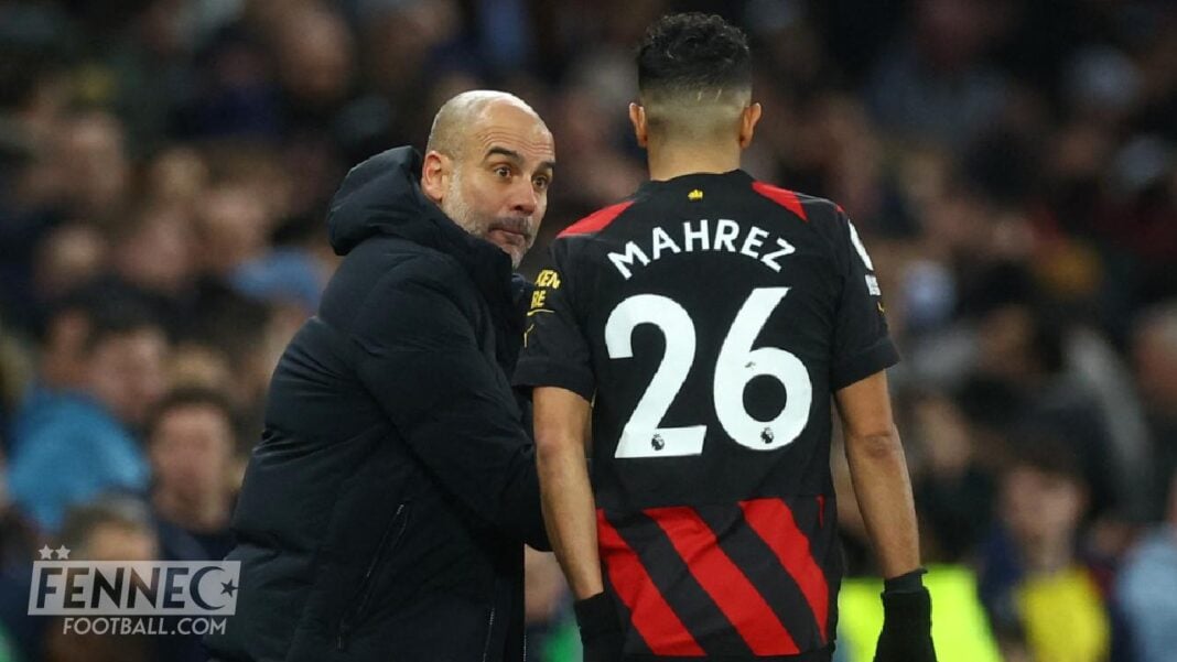 Manchester City : Riyad Mahrez n’en peut plus ! Voici l’étrange décision de Pep Guardiola à son encontre. Riyad Mahrez et Pep Guardiola lors d'un match de football.