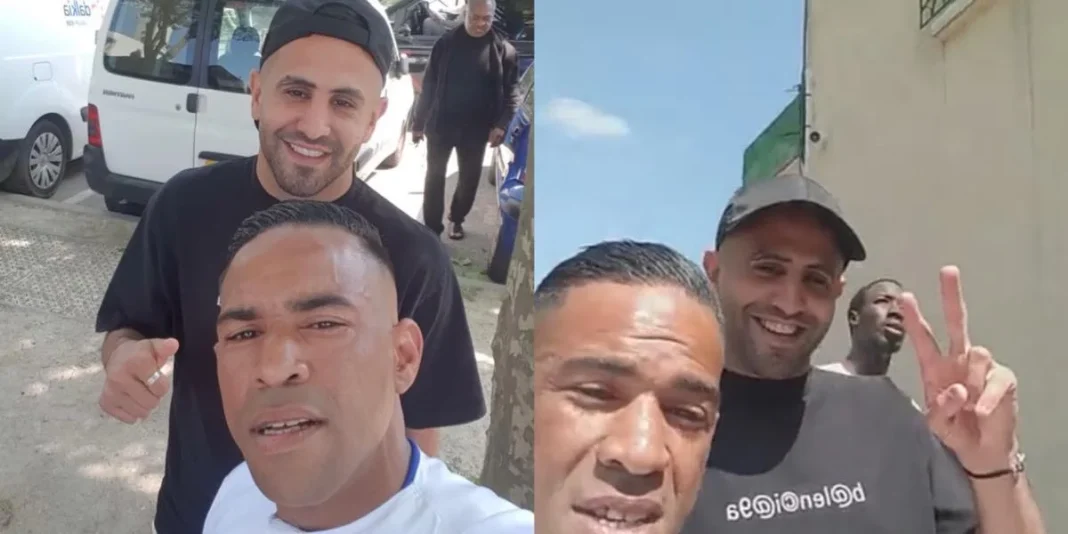 Riyad Mahrez rencontre ses siens à Sarcelles (vidéo) Riyad Mahrez avec des fans à Sarcelles, souriant et saluant.