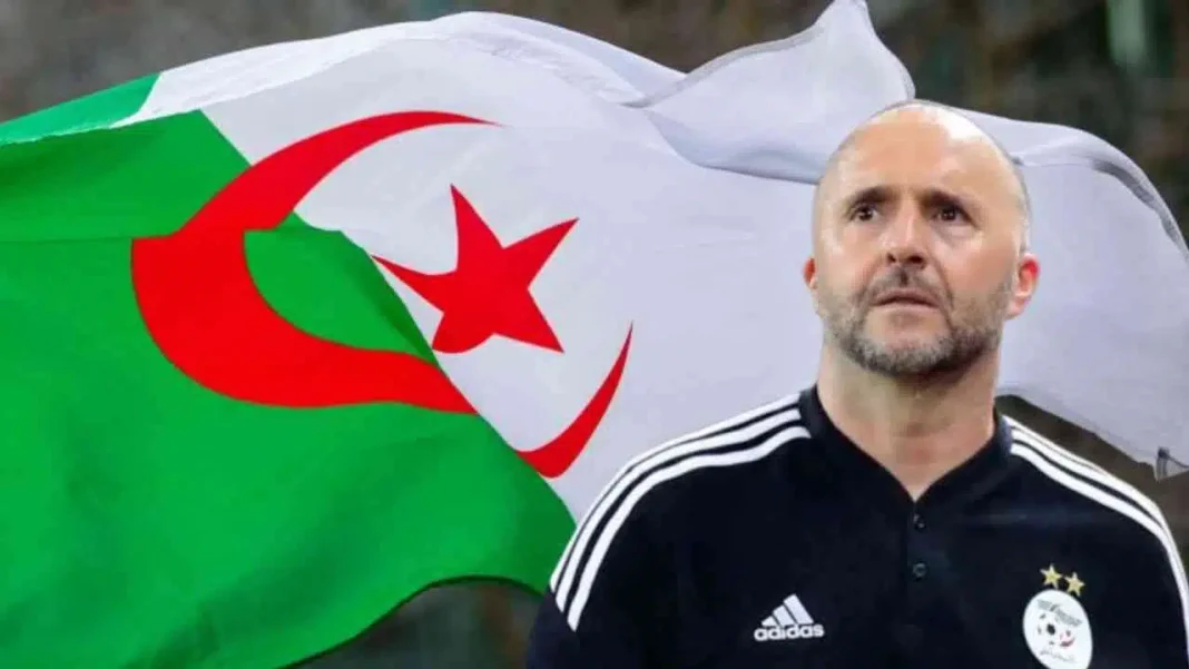 Equipe d’Algérie : Belmadi reçoit des menaces Belmadi devant drapeau algérien lors d'une rencontre sportive.