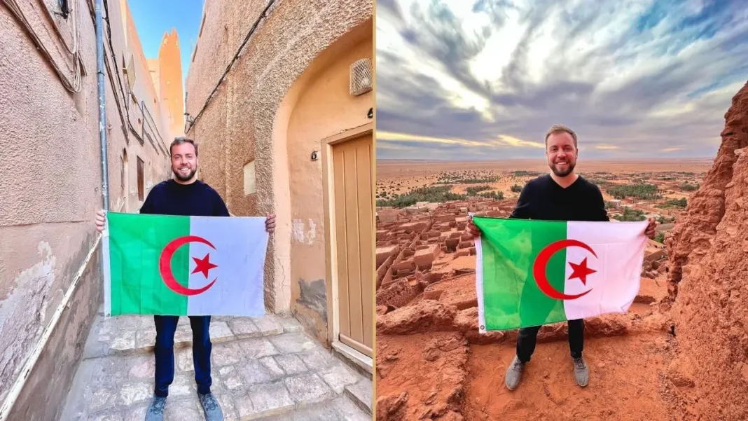 Cet Algérien de France envoie un message à Air Algérie Touriste algérien tenant un drapeau en Maroc avec paysage désertique.