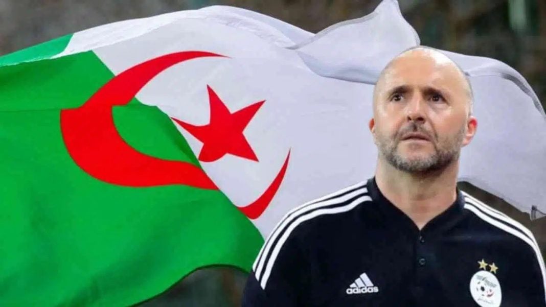Equipe d’Algérie : l’énorme révélation sur la liste de Djamel Belmadi Homme avec barbe devant drapeau algérien en fond.