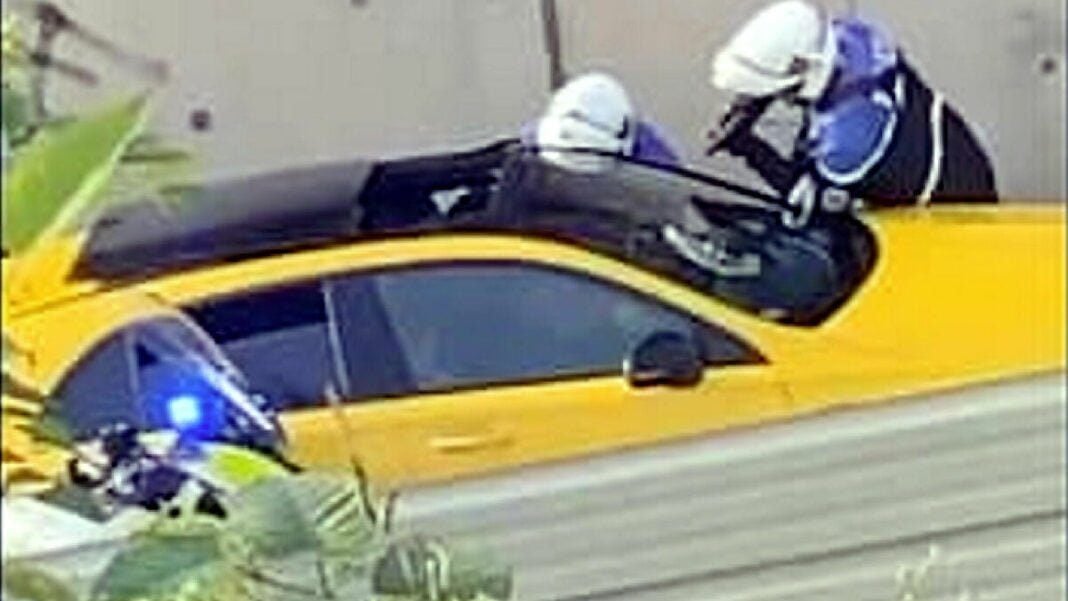 Affaire Nahel : L’officier de police accusé de meurtre maintenu en détention malgré une… Policiers en intervention avec un véhicule jaune lors d'une opération.