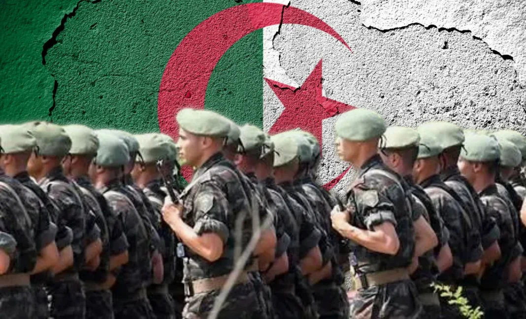 Gérald Darmanin , »je m’enorgueillis d’avoir un deuxième prénom qui est Moussa » Groupe de soldats en uniforme devant un mur peint du drapeau algérien.