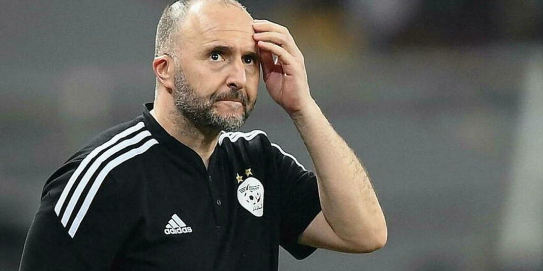 Révélations explosives de Djennad : Belmadi sans diplôme ? les secrets cachés du vestiaire Algérien dévoilés (vidéo) Djennad, entraîneur, en réflexion lors d'un match de football.