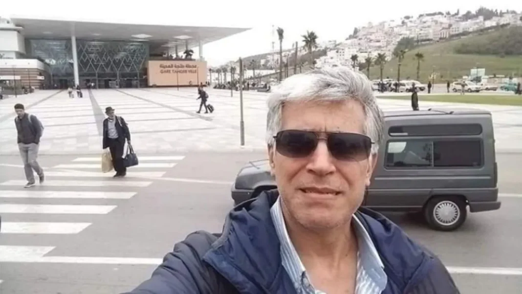 Décès de Mourad Sghir: des doutes planent sur l’affaire Homme portant lunettes de soleil devant un bâtiment moderne.