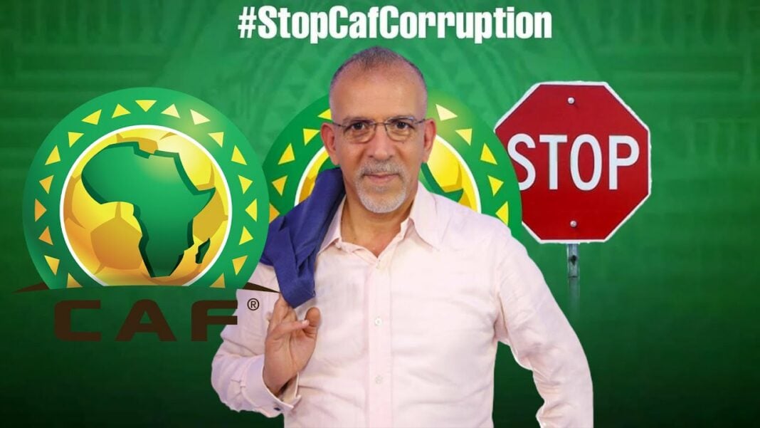 Hafid Derradji dévoile les coulisses du Gala de la CAF : des choix contestés et des absences notables Hafid Derradji devant un panneau STOP et symboles africains.