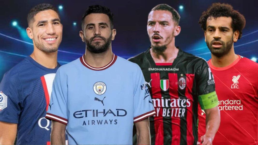 Quatre joueurs de football africains en tenue de match sur le terrain.