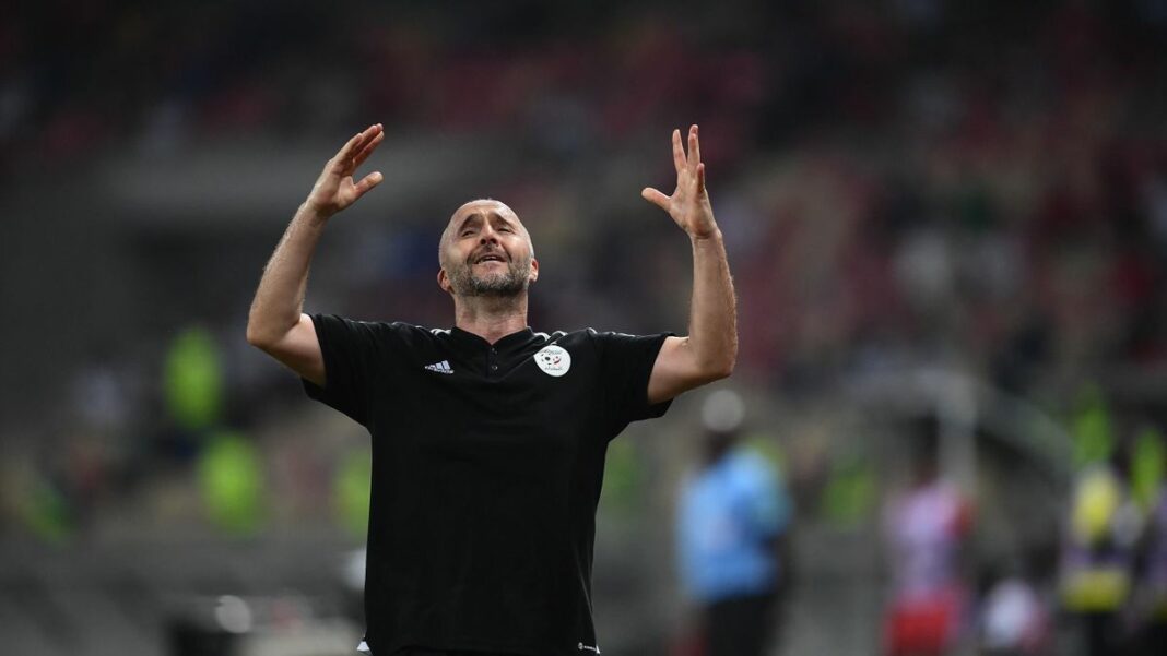 Djamel Belmadi, entraîneur de football, en action sur le terrain.