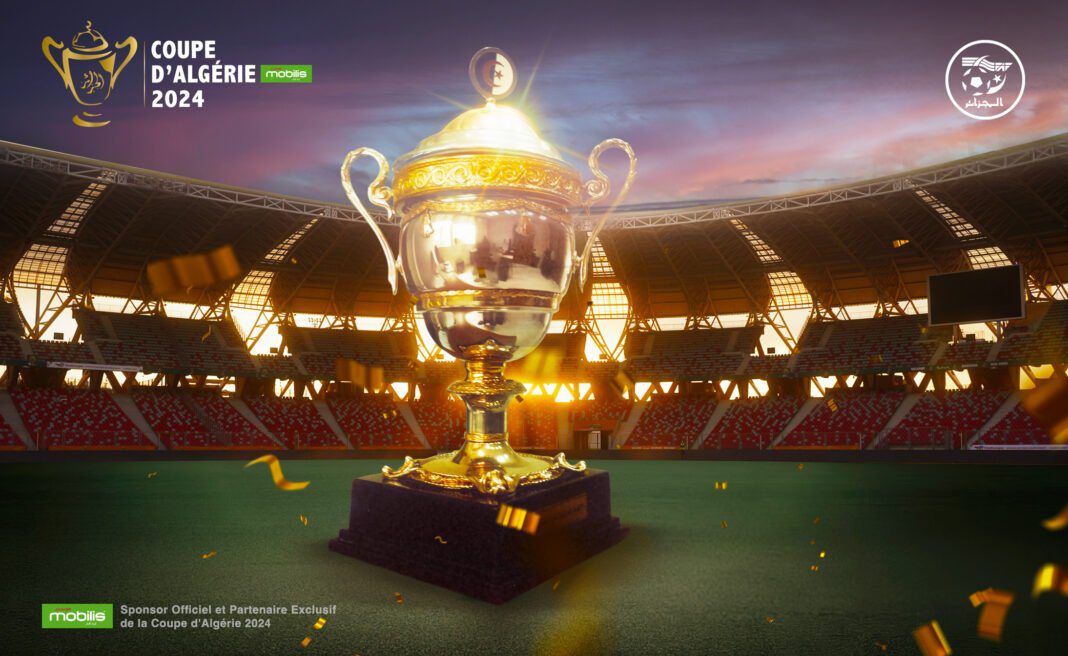 Coupe d’Algérie : Les demi-finales promettent des confrontations intenses et palpitantes Trophée de la Coupe d'Algérie 2024 dans un stade en soirée.