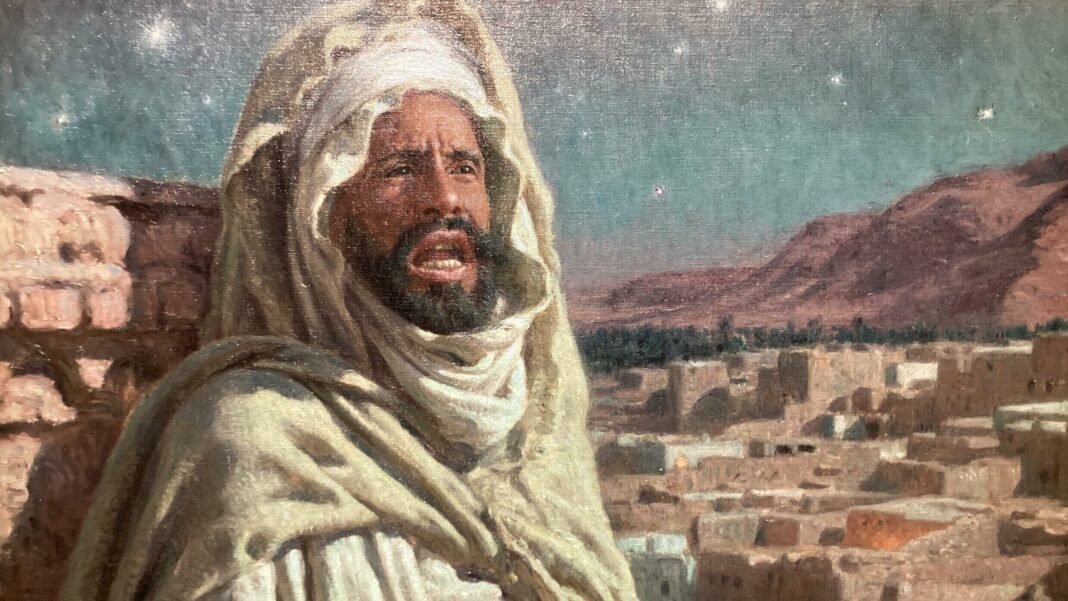 Découvrez la magie de l’Algérie à travers les yeux d’Étienne Dinet Homme en tenue traditionnelle dans un paysage désertique nocturne.