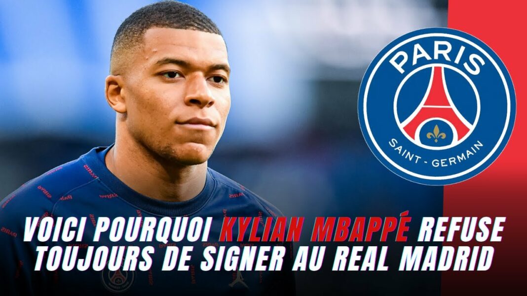 Real Madrid : Kylian Mbappé Refuse de Signer ! Kylian Mbappé avec le logo du Paris Saint-Germain en arrière-plan.