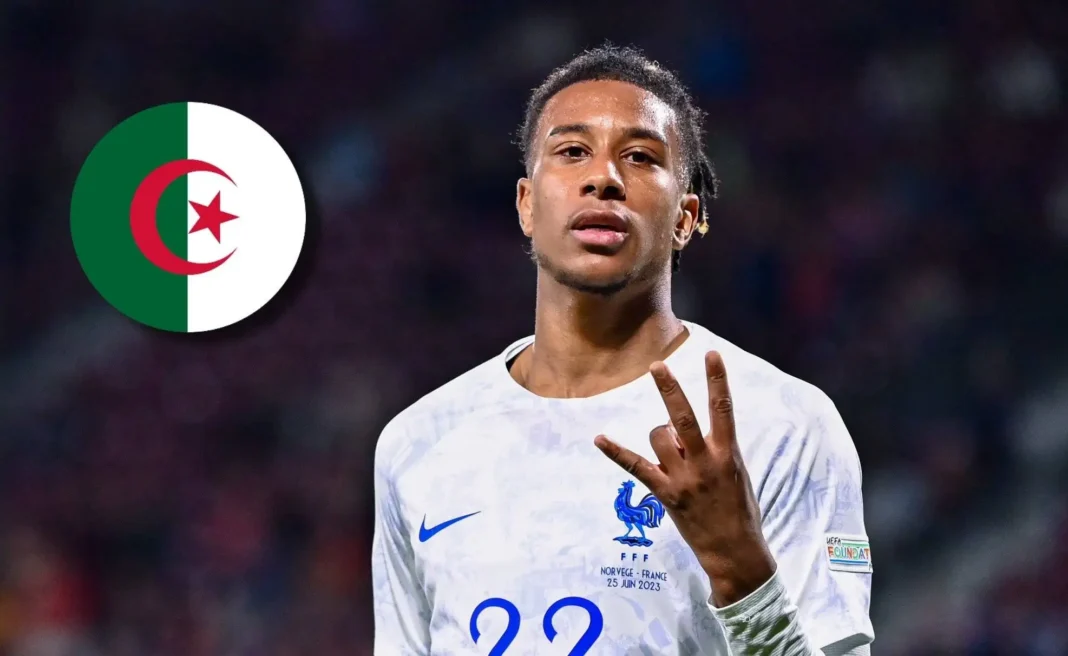 Michael Olise choisit la France et fait des révélations Michael Olise portant le maillot de l'équipe de France, faisant un geste de victoire.