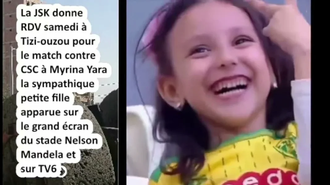La JS Kabylie est aux anges! Une jeune fille témoigne un amour fou pour le club Jeune fille heureuse portant un maillot de football de la JSK.