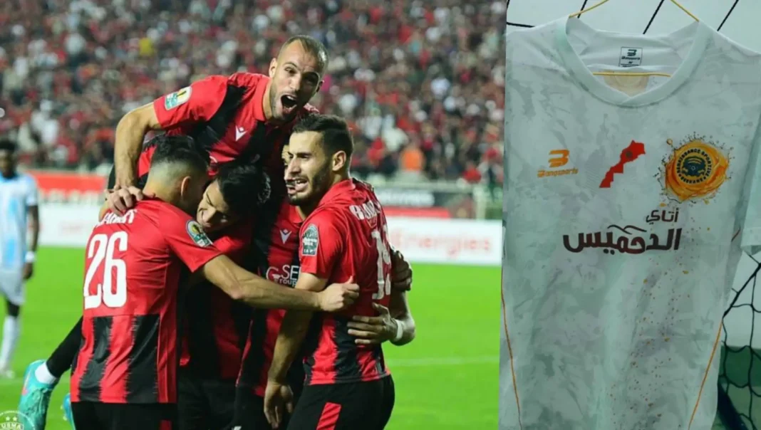 Victoire de l'USMA en football L'équipe de l'USMA célèbre une victoire importante.