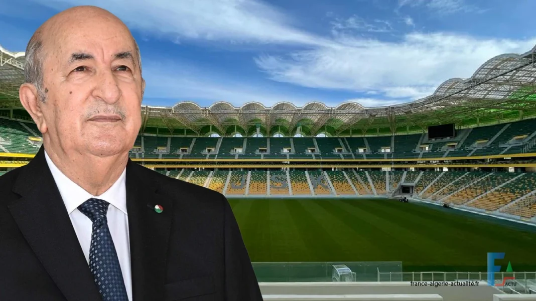 C’est officiel! Le stade Hocine Ait Ahmed inauguré ce jour. Un complexe qui se dresse, majestueux, en plein cœur de Tizi Ouzou Homme en costume devant le stade Hocine Ait Ahmed à Tizi Ouzou.