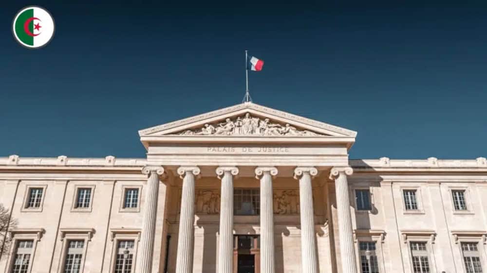 Refus de titre de séjour : un Algérien gagne en justice Bâtiment officiel avec drapeau français et algérien.