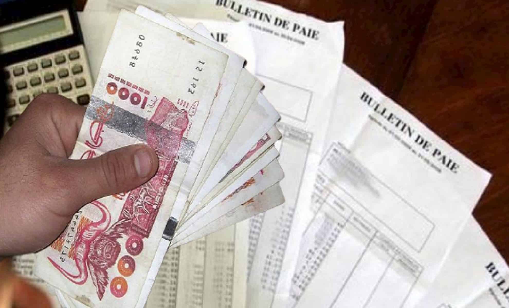 SNMG en Algérie : qui profite vraiment de la hausse Main tenant des billets de banque et bulletins de paie en Algérie.