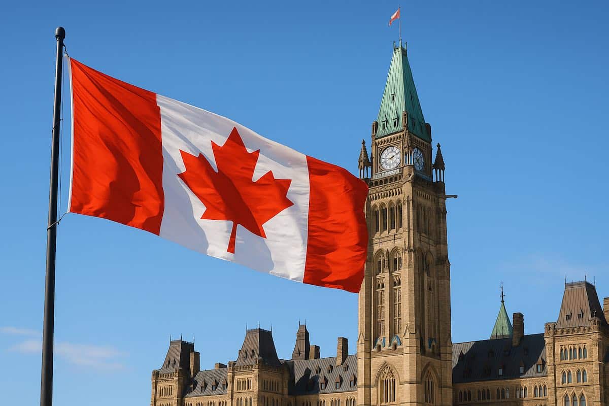 Canada : ce qui change pour les étudiants algériens dès maintenant Drapeau du Canada flottant devant le Parlement d'Ottawa.